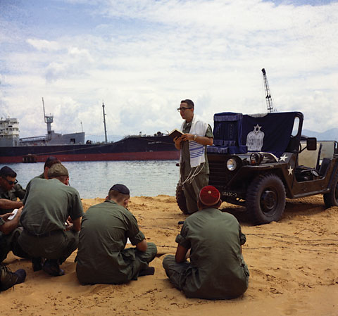 Chaplain Ernast D. Lapp of Brooklyn reads from Jewish Prayer Book as he leads 
religious services at Cam Ranh Bay, June 12, 1967. USMC Photo: Thomas L. Larsen
