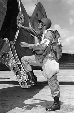 1st Lt. Thomas S. Whitecloud, a Chippewa from Lac du Flambeau Reservation in Wisconsin, enters a C-47. He was a medical officer and parachutist with the 515th Para. Inf., Fort Benning, July 1944. Photo: NARA