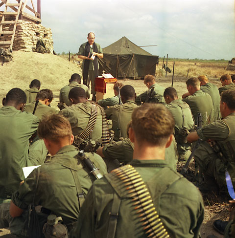 Chaplain Charles Voolker celebrates Thanksgiving service in the field for Co. C, 3rd Bn., 7th Inf., 199 LIB, Nov. 21, 1967.  USMC Photo:Melvin Vaughn