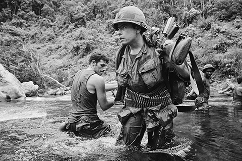 Members of Bravo Company, 4th Battalion, 31st Infantry—among the last U. S. combat troops still operating in the field—ford a river while on patrol about 11 miles west of Danang, August 1971.